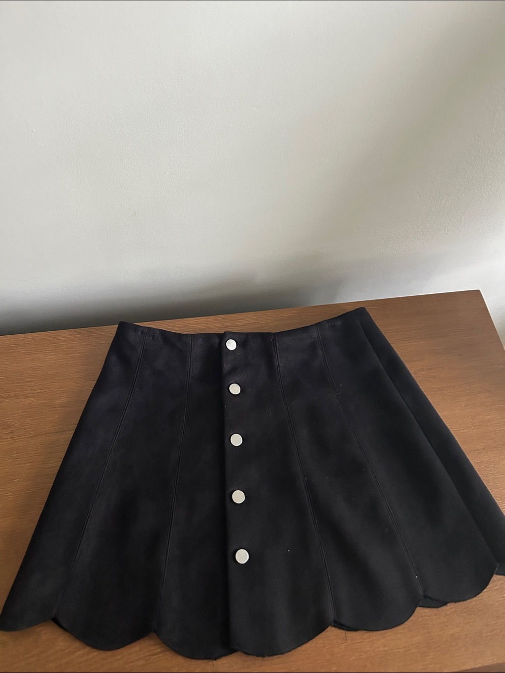 Black suede mini skirt with scalloped bottom